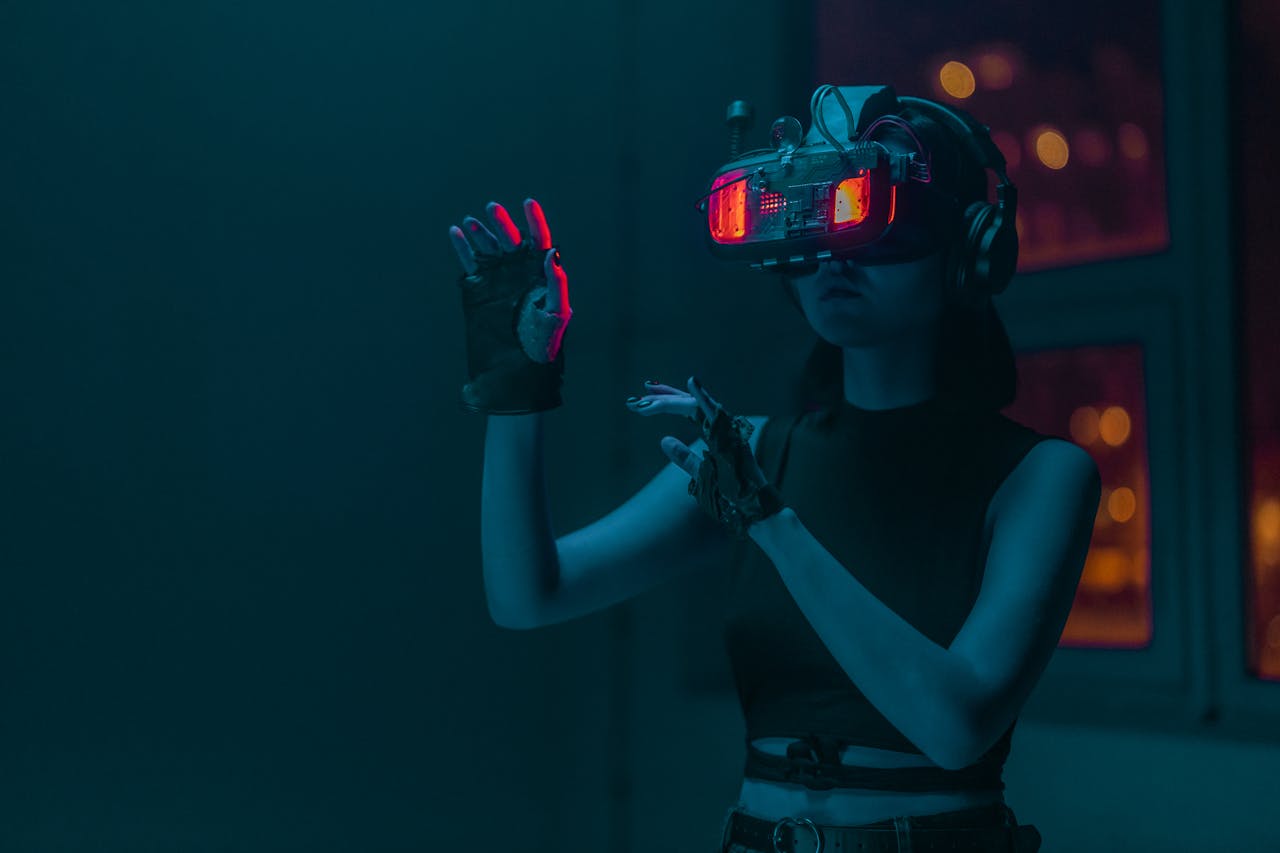 Woman exploring virtual reality with neon lights in a dark studio setting.